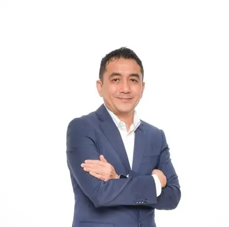 Man in suit, likely a professional in regenerative wellness or preventive healthcare in Malaysia.